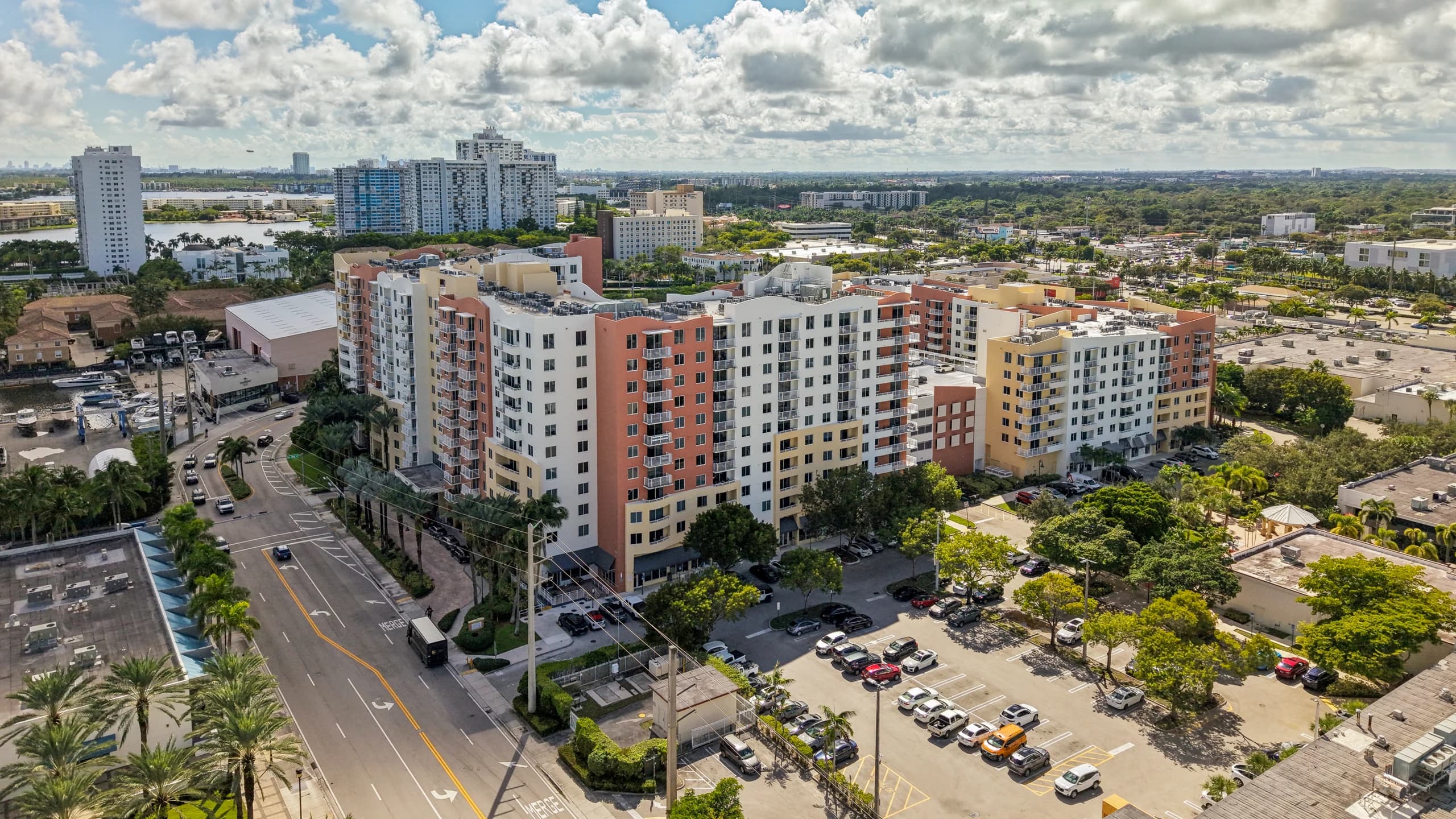 Aerial view of The Venture at Aventura, Aventura, FL, looking along the towers toward the street and parking