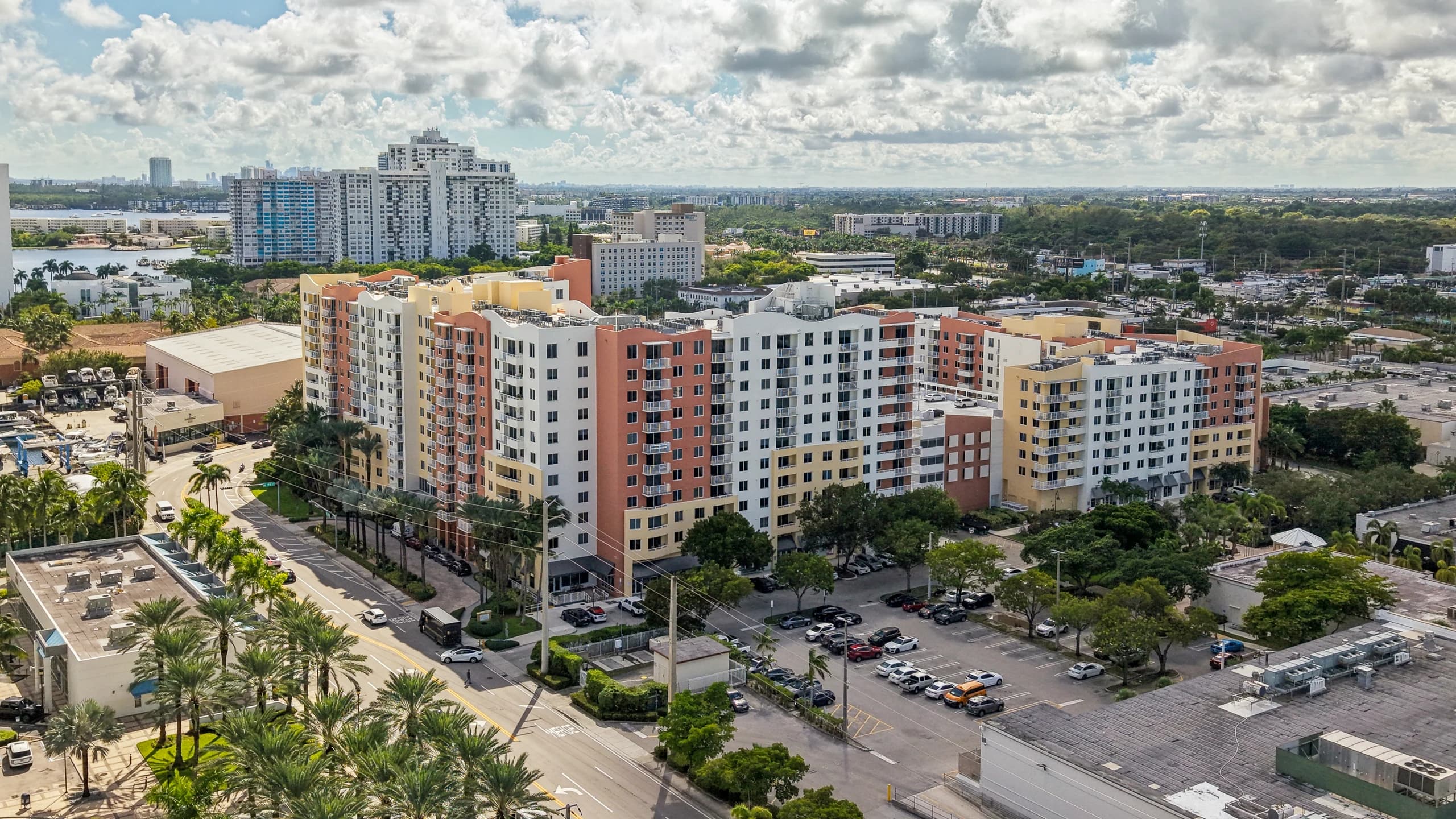 Aerial view of The Venture at Aventura, Aventura, FL, across the parking lot toward the towers