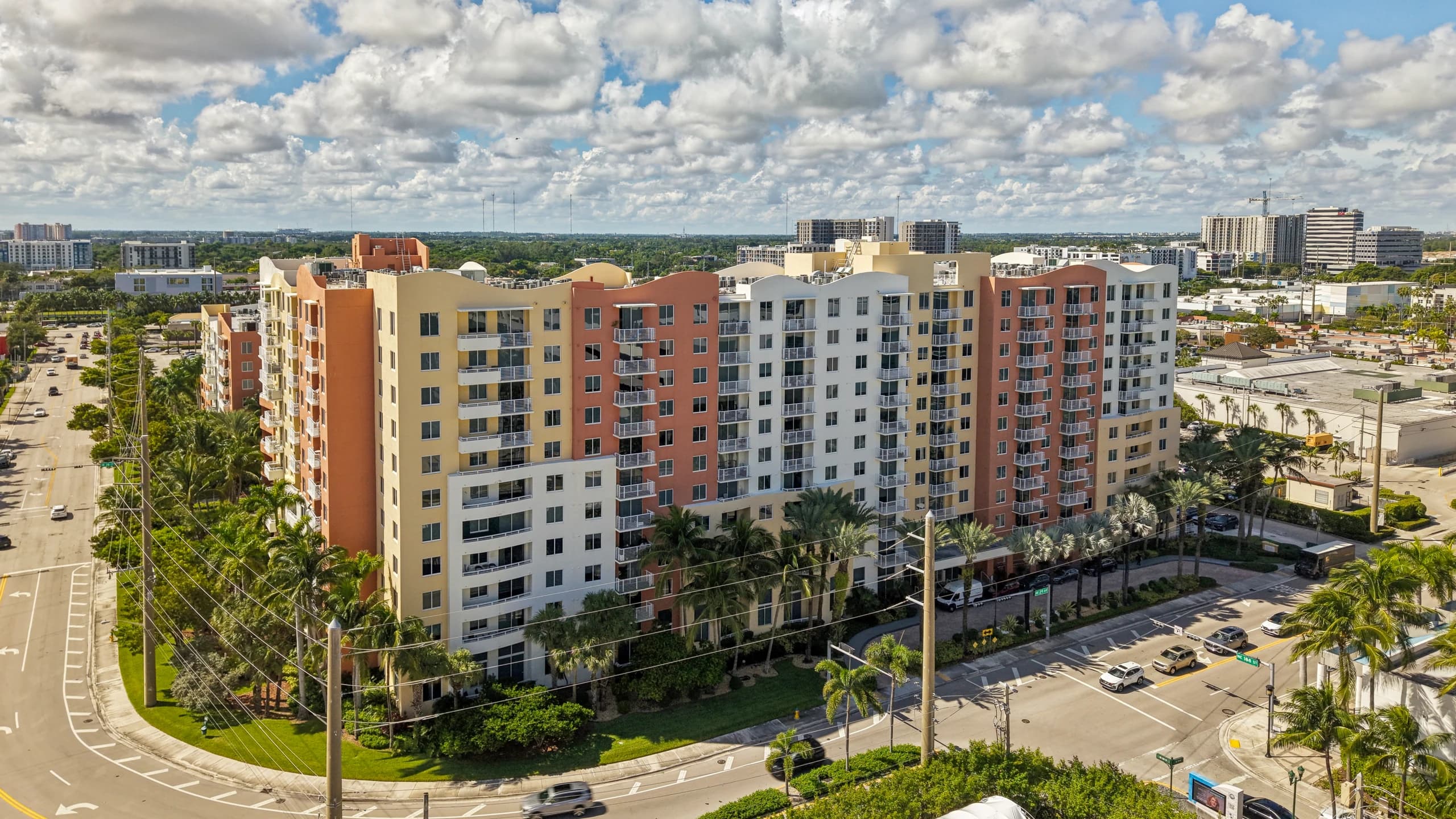 Aerial view of The Venture at Aventura, Aventura, FL, from the street corner with both towers in frame