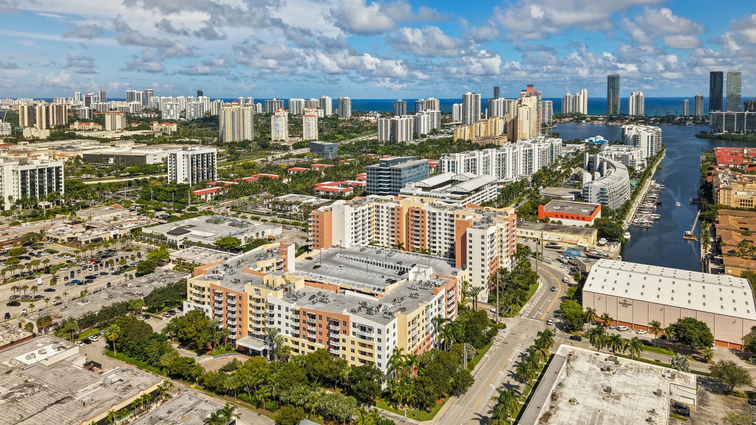 Aerial view of The Venture at Aventura, Aventura, FL, beside the Intracoastal with the ocean beyond