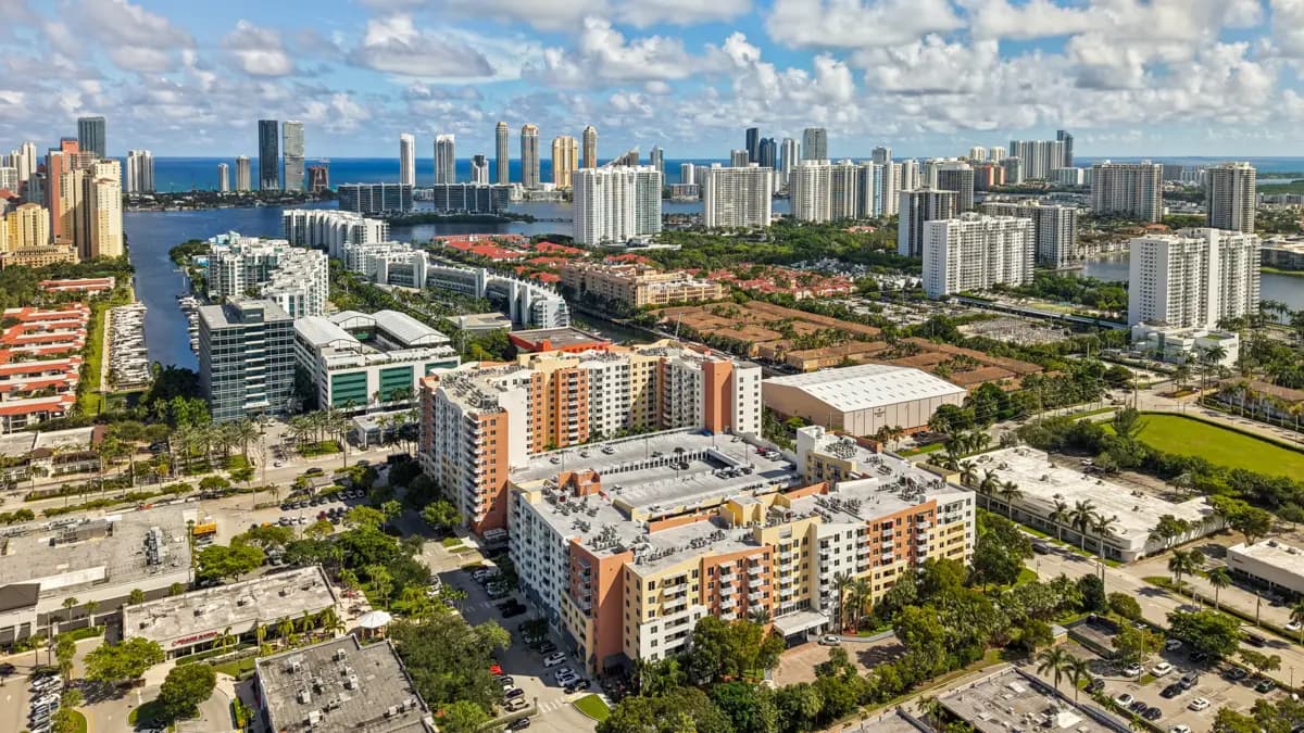 Aerial view of The Venture at Aventura, Aventura, FL, with the Intracoastal and Sunny Isles skyline beyond
